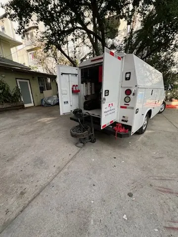 Magnet Plumbing service vehicle on-site for Grease Trap Cleaning in Spyglass